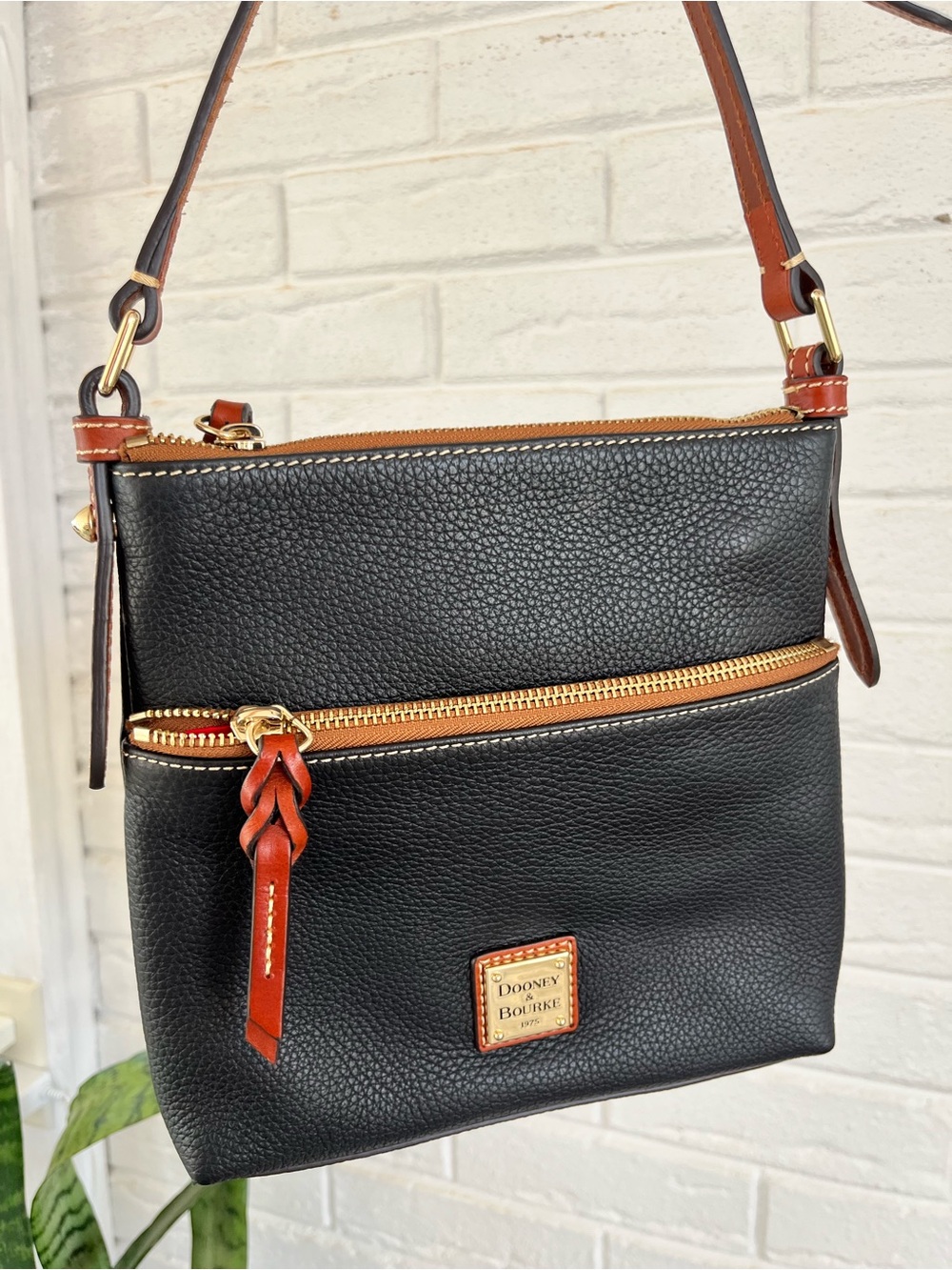 Dooney & Bourke black leather letter carrier crossbody purse, brown leather trim - Picture 2 of 12